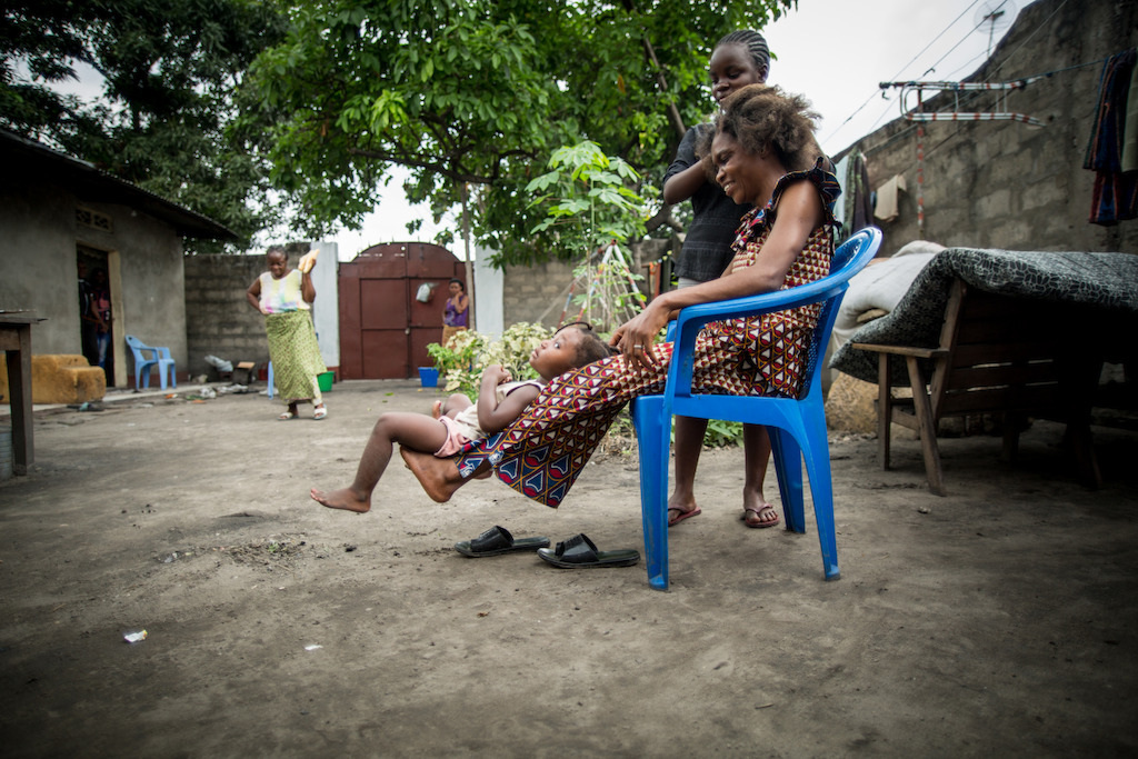 Philomène 47, discovered that she was HIV positive 14 years ago while she was pregnant. Philomène and her husband overcame the initial shock of the diagnosis and thanks to long counselling sessions with MSF teams they have managed to build a relationship and family life almost like anybody else's.<br/><br/>Since Philomène was put on a on antiretroviral treatment that prevents the transmission of the virus from mother to child, she and her husband have had two children who are HIV negative.<br/><br/><br/>Philomène is also a dedicated activist within the community group RENOAC which helps Congolese people live positively with HIV. While working as a RENOAC volunteer, she met Emerence, a young girl who had been abandoned by her family. Emerence now lives with Philomène's family who considers her like their own child.<br/><br/>This photo story highlights the different aspects of Philomène's life : as a woman living with HIV, a mother, wife, and activist. Photographer: Rosalie Colfs