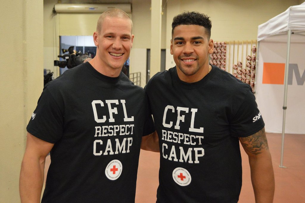Sam Giguere and Andrew Harris at the CFL Respect Camp with Red Cross presented by Shaw. Photo credit: CFL
