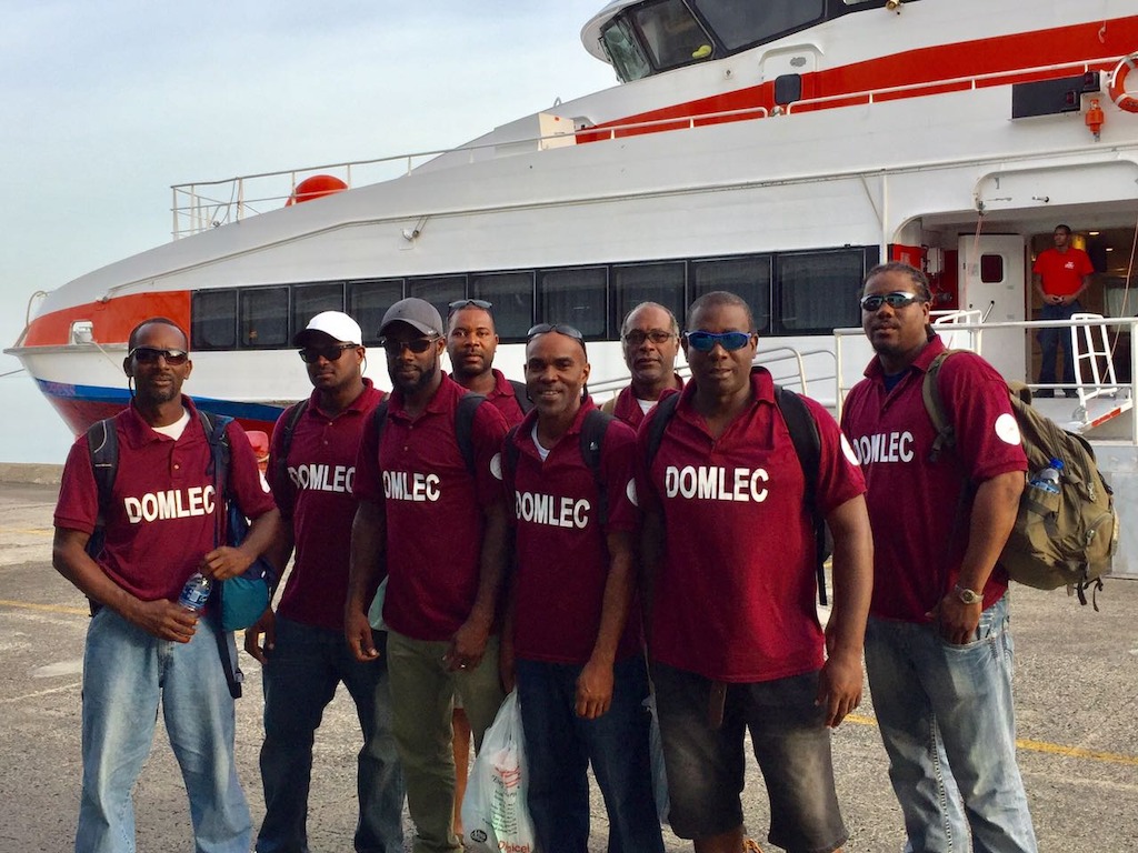 A team from Dominican Electricity Services arrive back home after helping in Anguilla