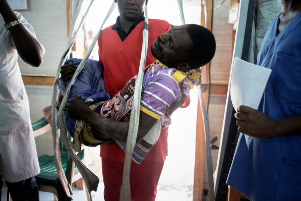 MSF159684<br/>A man is brought to the Medecins Sans Frontiers (MSF) hospital in a displaced persons camp in M'Poko, Bangui.<br/><br/>After being tied up and beaten by a group of men after asking for payment, having polished their shoes. He was referred to the General Hospital in Bangui.