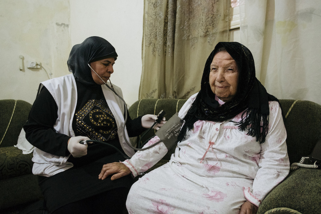 Amina Hamadi, 78, has diabetes and was suffering from loneliness and depression. Her physical illness and immobility had greatly affected her – especially as she believed people were tired of helping her. Today, Amina is smiling. In collaboration with our mental health support team we have lessened Amina’s depression. Photographer: Bruno De Cock