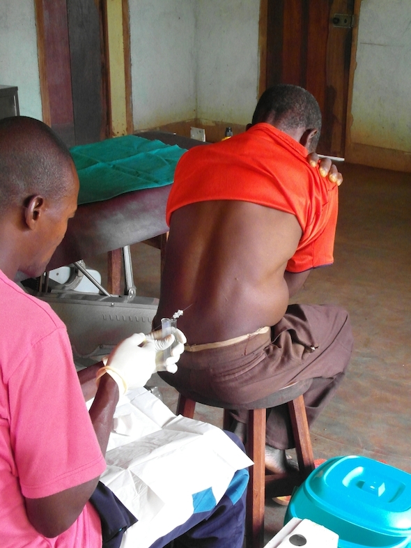 MSF mobile medical teams are spending 8 months travelling through DRC and aim to test and treat 42,000 people for sleeping sickness.<br/>Once the parasite is detected, a painful lumbar puncture must be made to examine the patient’s cerebro-spinal fluid. This will determine the stage of the disease and the appropriate treatment for the infected patient. Photographer: Philipp Frisch/MSF
