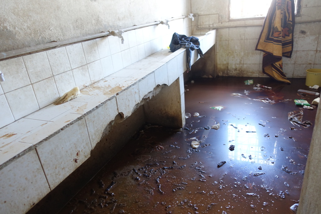 Sanitation area in a detention Center west of Misrata, ankle- deep urin and feces in the only place which inmates can use for washing and sanitation. No running water, no toilets or functioning showers at the time of visit. Photographer: Tankred Stoebe