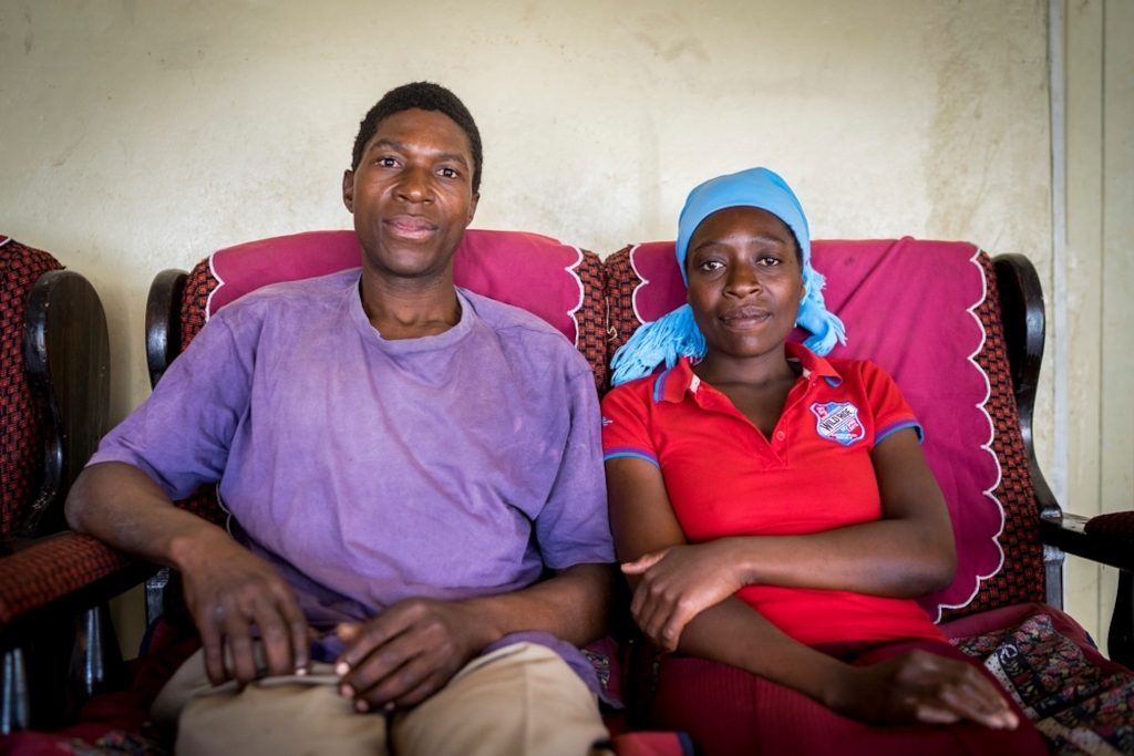 Portrait of Ngonidzashe (28) and her husband Hastings at home. They are a HIV positive couple supporting each other through ARV treatment, they also have 3 healthy children. © Melanie Wenger