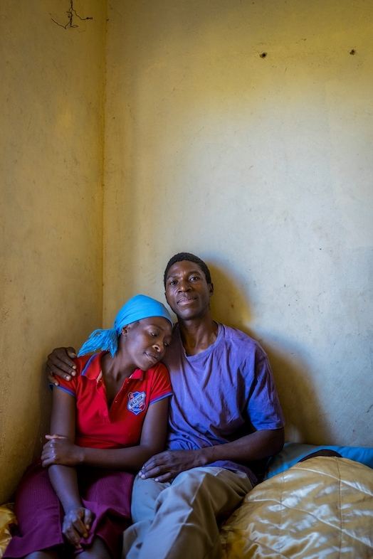 Portrait of Ngonidzashe (28) and her husband Hastings at home. They are a HIV positive couple supporting each other through ARV treatment, they also have 3 healthy children. © Melanie Wenger