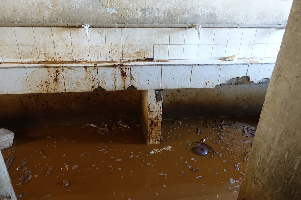 Sanitation area in a detention Center west of Misrata, ankle- deep urin and feces in the only place which inmates can use for washing and sanitation. No running water, no toilets or functioning showers at the time of visit. Photographer: Tankred Stoebe