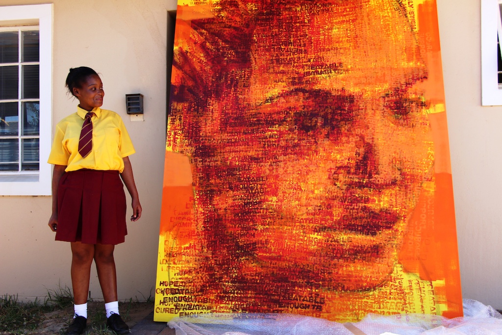 Sinethemba Kuse with her portrait / artwork. Photographer: MSF