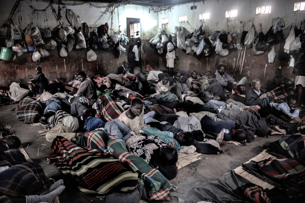 System identifier<br/>: MSF149528<br/>Title<br/>: Malawi Prisons - Chichiri and Maula<br/>Photographer / cameraman<br/>: Luca Sola<br/>Countries:<br/>Malawi<br/>Description<br/>: MALAWI. Blantyre. May 25th, 2015. Chichiri Prison Description:MALAWI. Blantyre. May 25th, 2015. Chichiri Prison. <br/><br/>Overview of an overcrowded cell portrayed early in the morning (6am) The prisoners are waiting the authorization to go out to the common space after some 14 hours spent in critical condition. Overcrowding is a critical problem in Malawian jails. Chichiri Prison was built to house 800 prisoners instead of the 2000 currently detained there. According to medical statistics this specific cell 5, one of the most overcrowded, have the most case of viral transmissions (Tuberculosis, Hepatitis, Malaria, HIV) as well as the highest percentage of other diseases related to unhygienic conditions (Scabies, skin infections, rash).
