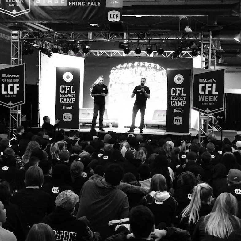Spencer Moore & Mike Reilly onstage at the CFL Respect Camp with Red Cross presented by Shaw. Photo credit: Red Cross Saskatchewan