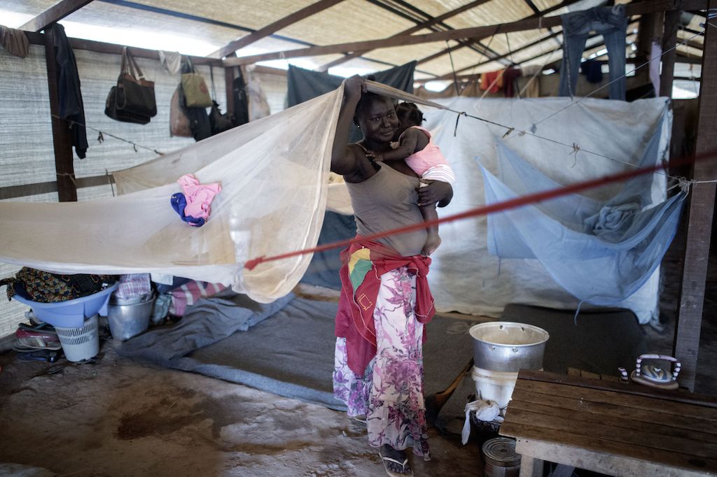 Portrait of 28 year old Zongamboy inside a shelter at a displaced persons camp in Benzvi, Bangui.