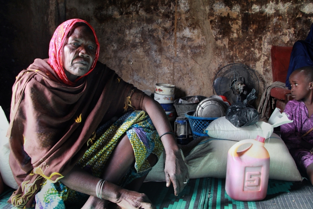 Hauwa Abba, 55, was forced to flee her home in Abadan two years ago following an attack, and has been living in a camp in Maiduguri with her family ever since. They were one of 500 families to receive a food distribution from MSF on December 14, 2016. Photographer: Malik Samuel/MSF