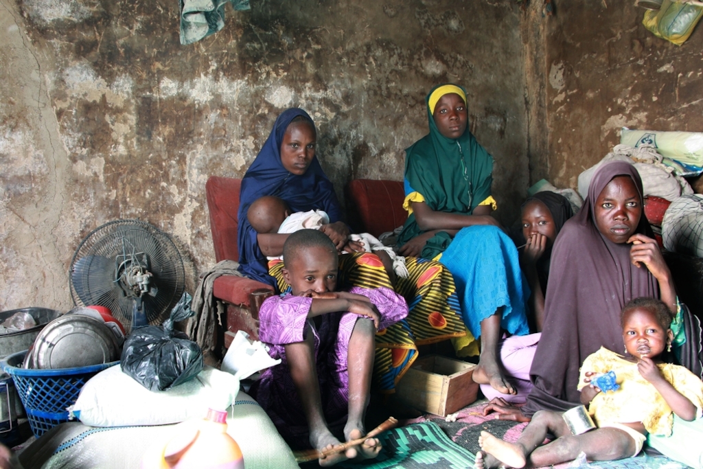 The Abba family left their home in Abadan two years ago, and have been living in a camp in Maiduguri ever since. They were one of 500 families to receive food from MSF on December 14, 2016. Photographer: Malik Samuel/MSF