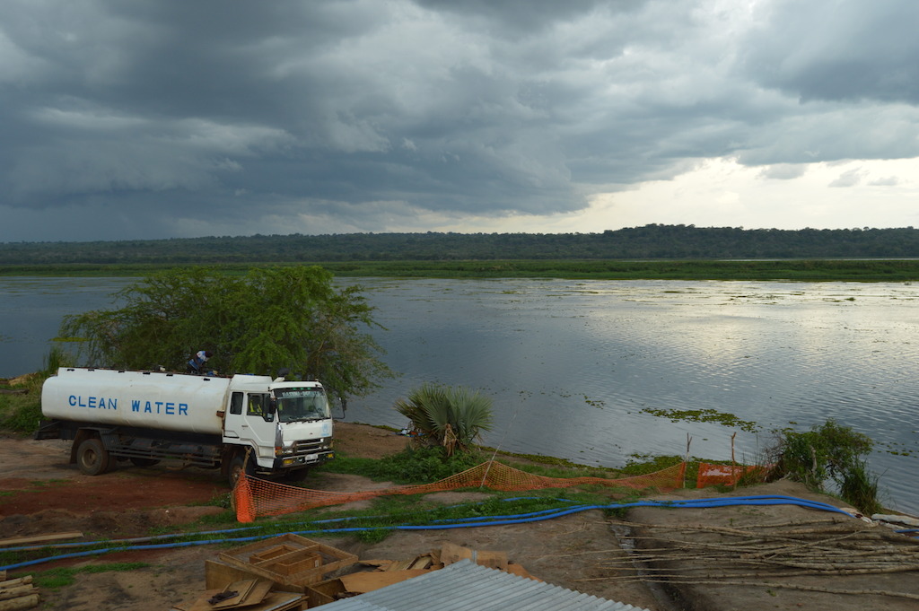 A water truck is seen at MSF’s water treatment plant in Palorinya refugee settlement, northern Uganda. MSF produces an average of 2 million litres per day from the Albert Nile River, which is delivered to tanks throughout the settlements by water trucks rented by UNHCR. Bad road conditions make it difficult for trucks to access all areas of the settlements after heavy rains, leaving several areas vulnerable to water shortages. <br/>By 5 May 2017, there were over 901,755 South Sudanese refugees in Uganda, with the number expected to rise to nearly one million by the end of the year. Some 86% of the South Sudanese refugees in Uganda are women and children under 18, and an average 2,000 new refugees arrive each week. Uganda is now the largest hosting country for South Sudanese refugees, and also the country hosting the largest population of refugees in Africa.<br/>population of refugees in Africa. Photographer: Yuna Cho/MSF