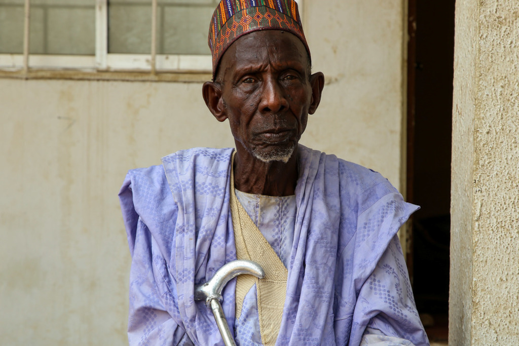 Baba Makintu, community elder from Damaturu town (Yobe state, northern Nigeria), 92 years old. “When I was younger, at around 25 years of age, I got meningitis. It affected my vision. For a while I couldn’t see anymore. It also deformed one of my legs. It is now very weak. This disease has hit many of my family members in Damaturu. I have seen people die because of it, creating havoc in many families. This is why I think it is so important to get vaccinated. We encourage everyone to carry out such interventions.” Photographer: Igor Barbero/MSF
