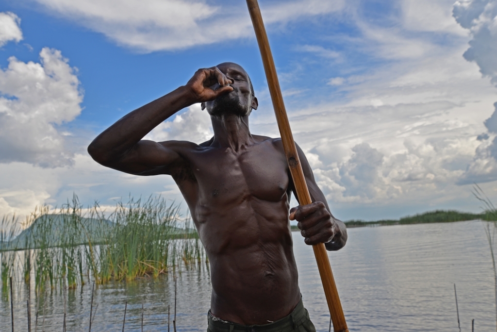 A fisherman on Lake Chilwa in Malawi takes an oral cholera vaccine as part of MSF's efforts to stem a cholera outbreak in Machinga, Phalombe and Zomba districts. Photographer: Aurelie Baumel/MSF