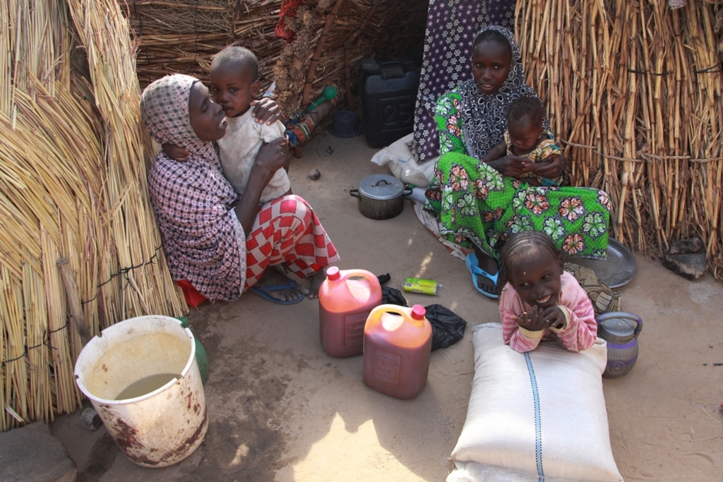 Maira Modu, 30, (left) who has six children, fled her village in Bama one year ago following an attack. They have been living in a camp in Maiduguri ever since. Photographer: Malik Samuel/MSF