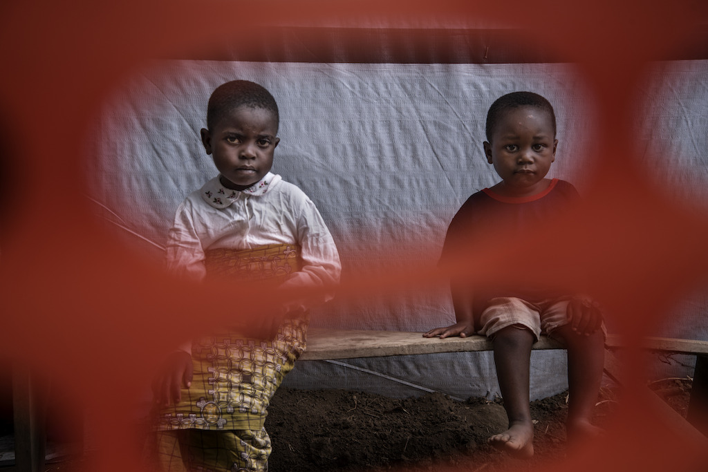Two children who have almost recovered at the cholera treatment centre in Minova. They are waiting for the doctor for a final check-up before they are discharged. Photographer: Arjun Claire