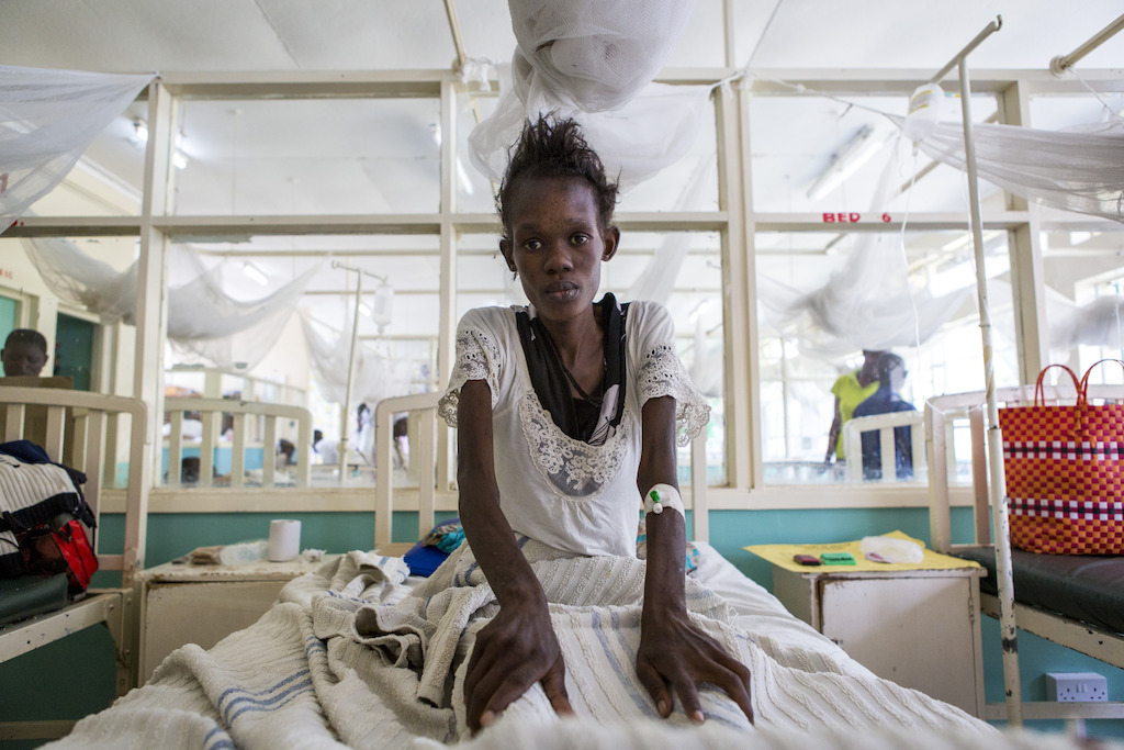 Homa Bay, Kenya: Winnie, 25 years, tested HIV positive in 2015 and prescribed antiretrovirals. For two years, she was referred to numerous health facilities which made a proper diagnosis and treatment difficult. She was recently admitted for severe vomiting and diarrhoea. She was married but now lives with her mother. <br/><br/>Studies show that 25% of people in HIV care will interrupt their treatment at some point, for some reason, for a few days to several months. Photographer: Patrick Meinhardt