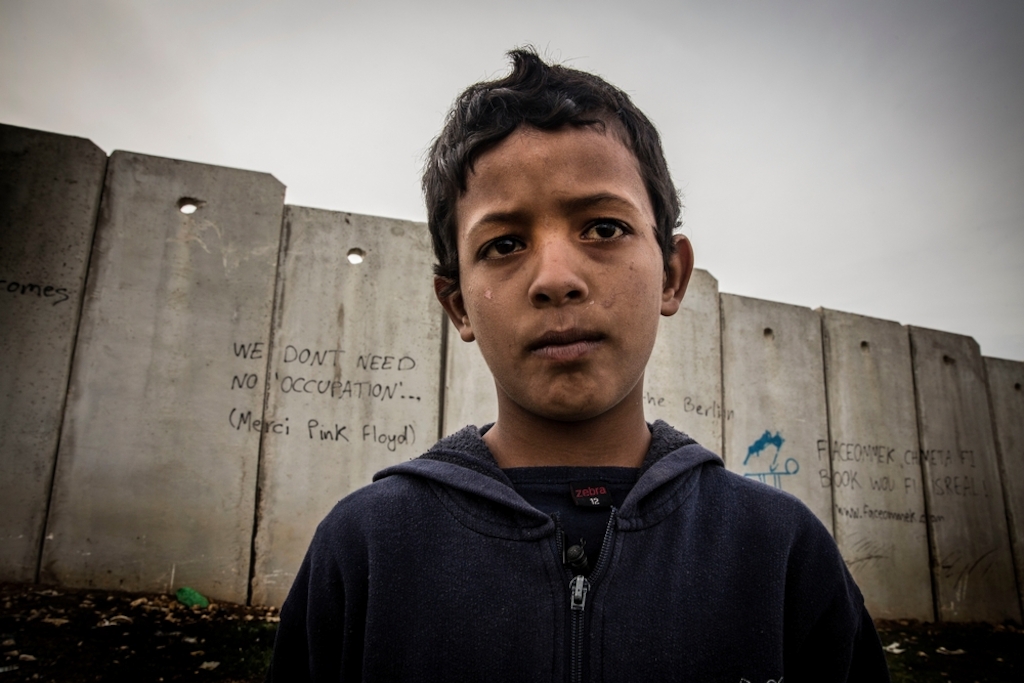 MSF Photos of 2015<br/>System identifier<br/>: MSF150048<br/>Title<br/>: Occupied Minds_ Mustafa Suliman<br/>Photographer / cameraman<br/>: Surinyach Anna<br/>Countries:<br/>Palestinian Territories. Mustafa is only 11 years old but he has already been detained for interrogation. He lives in a makeshift shed with 21 other people from his extended family. He has seven siblings and his parents live in Jericho, one hour drive away with their sheep, where he goes on the weekends. He likes math and Arabic besides science and would like to work with his father in a supermarket and looking after the sheep.<br/>Mustafa is only 11 years old but he has already been detained for interrogation. He lives in a makeshift shed with 21 other people from his extended family. He has seven siblings and his parents live in Jericho, one hour drive away with their sheep, where he goes on the weekends. He likes math and Arabic besides science and would like to work with his father in a supermarket and looking after the sheep.