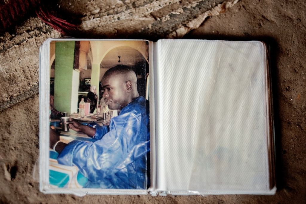 MSF159644<br/>Photograph of Alima's son, Amousa who was 23 years old at the time of his death.<br/><br/>He was treated at the Red Cross Center after he became ill due to the living conditions in the camp.<br/><br/>Alima is trying to cope by relying on the help of other people living with her in the camp, as she and her husband are unemployed. “We were born here, our parents and grandparents too... and now we are treated as strangers".