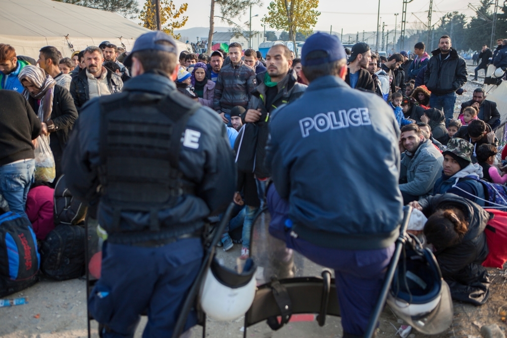 Photographer: Alex Yallop<br/><br/>Caption: Refugees from Iraq, Afghanistan and Syria wait to cross the border from Idomeni, Greece into Macedonia.
