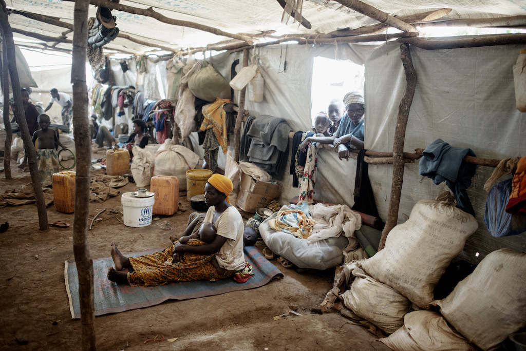 Inside one of the mass shelters in Nyarugusu camp. The shelters were built to house 200 people, but in some cases, they host up to 370. Photographer: Luca Sola
