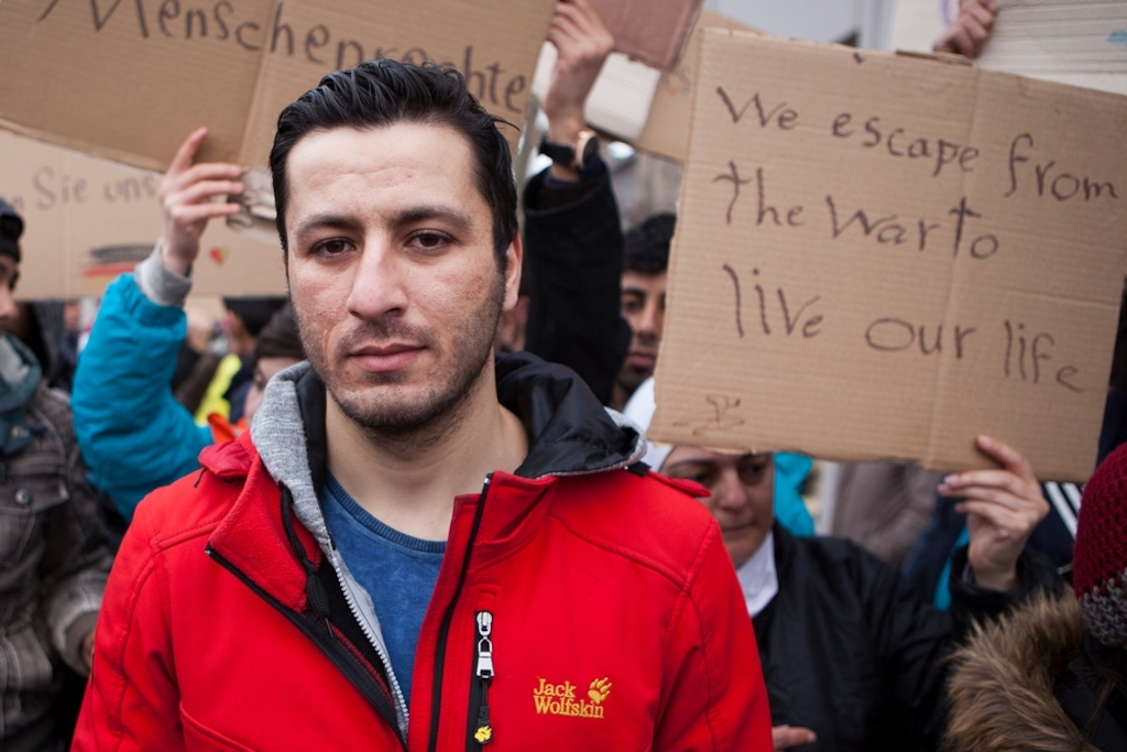 Iwath, from Iraq, protests against border controls outside a reception centre for migrants and refugees near Sid, Serbia. "We want freedom and a future - we don't have freedom in my country. I want to continue my journey, I can't go back." Photographer: Alex Yallop/MSF