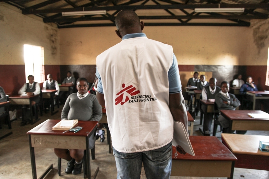 Learners of Hhashi High School in the remote Umlalazi Municipality under Uthungulu Districtict in KwaZulu-Natal stand in line to receive HIV Counselling and Testing at Medecins Sans Frontieres (MSF) Mobile 1-Stop Shop. MSF uses the vehicle to deliver HIV Counselling and Testing to people of all ages in rural KwaZulu-Natal, the South African province with the highest prevalence of HIV infection. Photographer: Greg Lomas / Médecins Sans Frontières