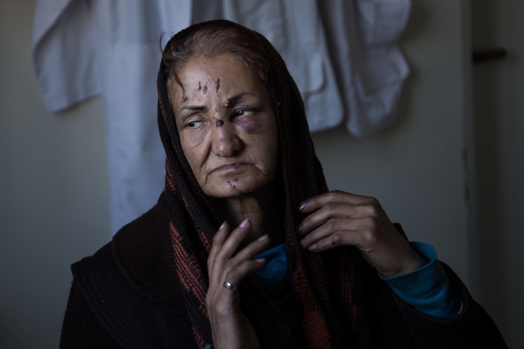 A woman adjusts her veil in MSF's clinic in Harandi, Tehran, which provides medical and psychological care for vulnerable women and children, drug users and their families, sex workers, Afghan child workers and the gypsy community, amongst others. Photographer: Mahsa Ahrabi-Fard