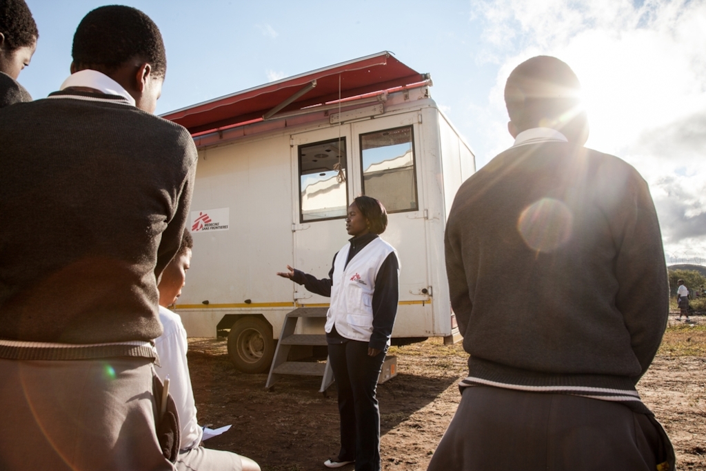 Learners of Hhashi High School in the remote Umlalazi Municipality under Uthungulu Districtict in KwaZulu-Natal stand in line to receive HIV Counselling and Testing at Medecins Sans Frontieres (MSF) Mobile 1-Stop Shop. MSF uses the vehicle to deliver HIV Counselling and Testing to people of all ages in rural KwaZulu-Natal, the South African province with the highest prevalence of HIV infection. Photographer: Greg Lomas / Médecins Sans Frontières