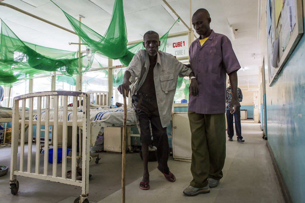 Homa Bay, Kenya: John, 56 years, was diagnosed with HIV in 2015 and has been taking antiretrovirals ever since. He was admitted in Homa Bay hospital in July 2017 with back and chest pain, and needs assistance for most tasks. <br/><br/>Around 65% of AIDS admissions to the hospital have already been on antiretrovirals before, with 50% showing some form of treatment failure. Photographer: Patrick Meinhardt