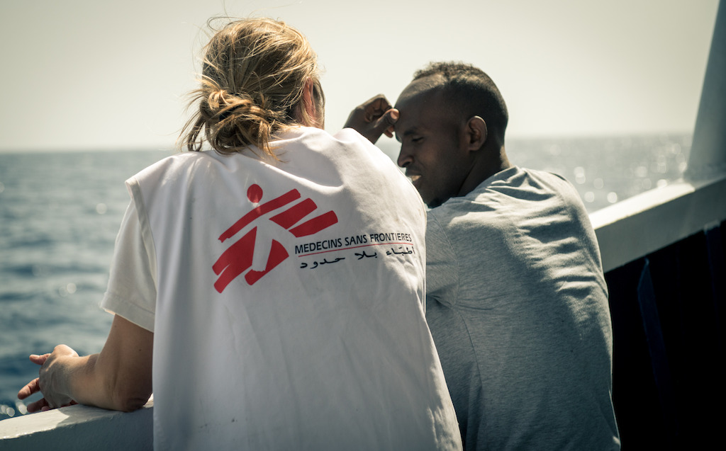 Credit: Gabriele François Casini / MSF Caption: Doctor Erna Rijnierse has a chat with an Eritrean man assisted on May 7th 2015. MY Phoenix search rescue and medical aid vessel jointly operated by MSF and MOAS successfully completed their second rescue of 2015. During the rescue 219 people were brought on board the MY Phoenix including 55 women (3 pregnant) and 33 children including 9 children under 5 and 2 babies of 3 month old and 1 year and four month. The majority of which were from Somalia and Syria. In the hours following the rescue the MSF triaged all patients and had consultations with those with medical issues.