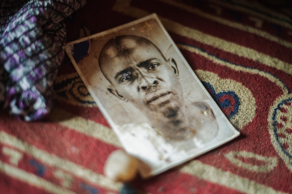 MSF159646<br/>Portrait of Alima's father, Adam.<br/><br/>Alima and her family lived at the Miskin market in Bangui before the violence. One day armed groups surrounded the neighbourhood and killed people there. After this, she fled with her family (4 boys, 3 girls and her little brother) to find safety at the Central Mosque of Bangui in PK5. <br/><br/>Alima is trying to cope by relying on the help of other people living with her in the camp, as she and her husband are unemployed. “We were born here, our parents and grandparents too... and now we are treated as strangers".