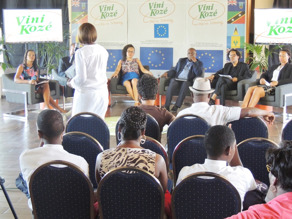 Member of the audience engages with the panel at the Vini Koze Forum on Economic Growth in Grenada.