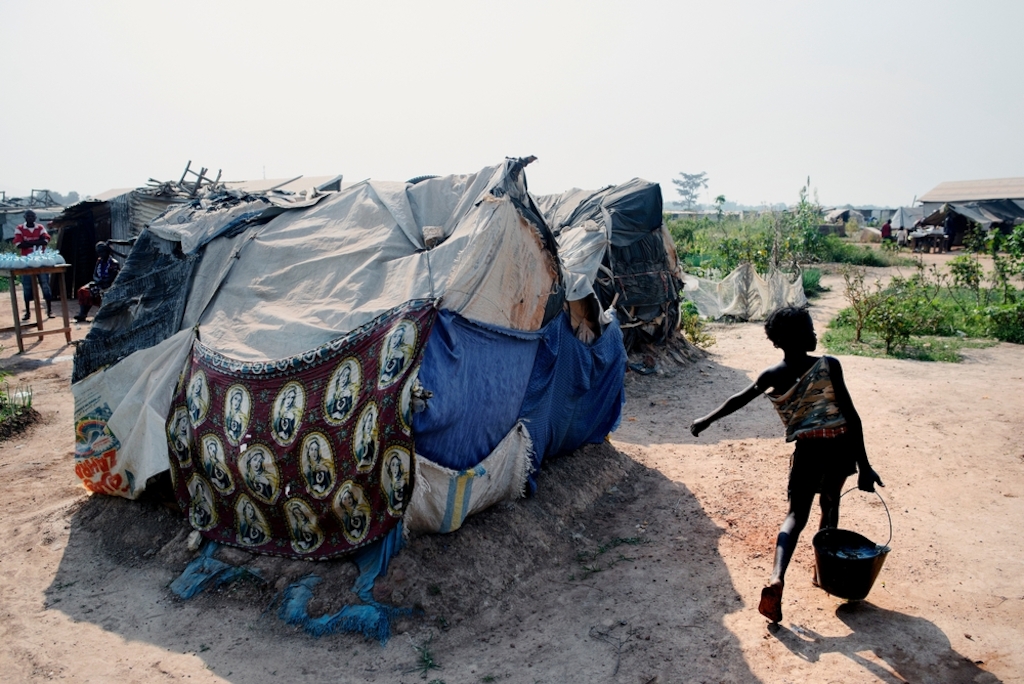 General view of the a displaced persons camp in M'Poko, Bangui. Photographer: Luca Sola