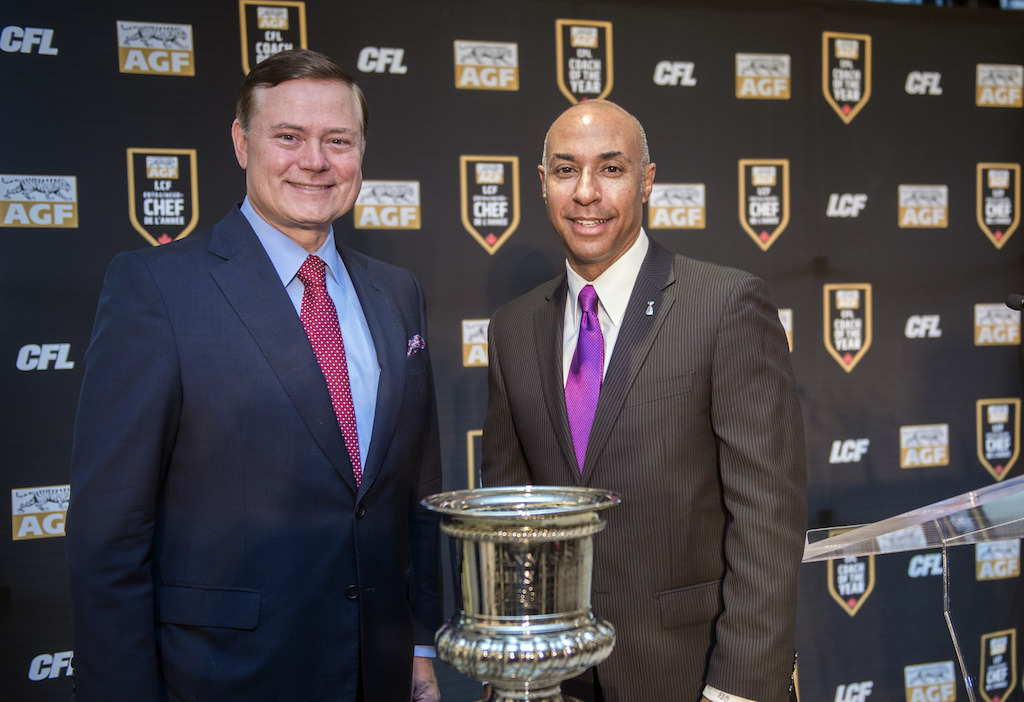 Blake C. Goldring, Chairman and CEO at AGF and Jeffrey L. Orridge pose with the Annis Stukus Trophy. CFL/Adam Gagnon
