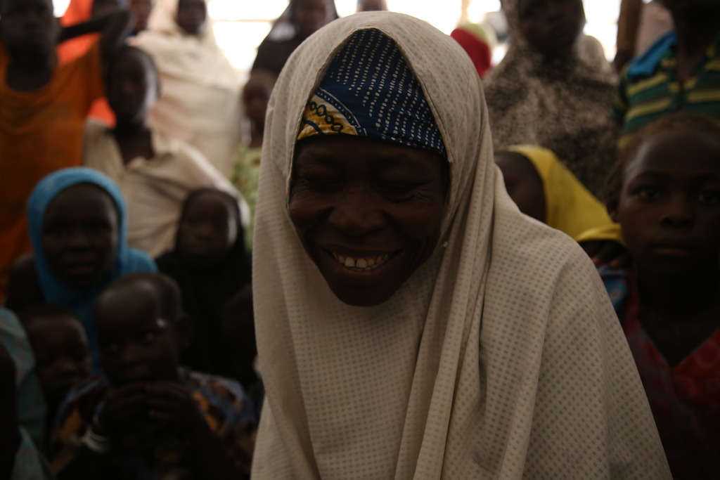 A woman who has been displaced by the conflict between the Nigerian armed forces and Boko Haram sits in the compound where MSF runs a hospital in the northeastern town of Pulka. Photographer: Igor Barbero