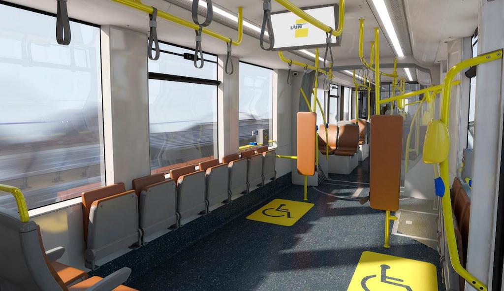 Interieur CAF-tram met klapstoelen en 2 rolstoelplaatsen.