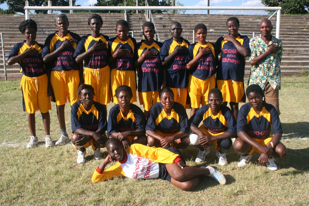 A group of HIV-positive women in Epworth, one of Zimbabwe's poorest townships, decided to form a soccer team and to compete in tournaments. They are fighting stigma by showing everyone the meaning of positive living. All members of the team called ARV Swallows are MSF patients and receive antiretroviral treatment at the Epworth Polyclinic, where MSF treats almost 7.000 HIV-positive patients a year. ARV Swallows team together with their Coach, Jonas. Photographer: Joanna Stavropoulou