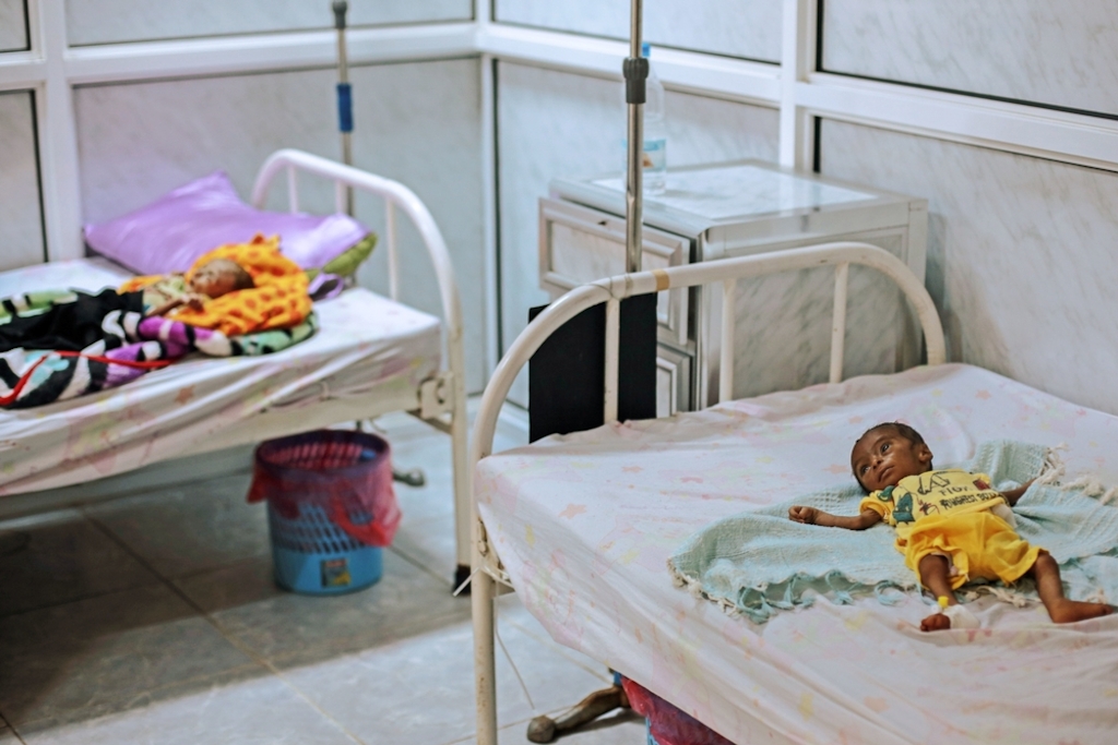 Eight-month-old Ayashi Ibrahim lies on a bed in Al Thawra hospital, Hodeidah, Yemen, suffering from severe acute malnutrition, which is life-threatening. The conflict in Yemen has caused severe food shortages, and this is the second time Ayashi has been admitted to the hospital's malnutrition centre. Photographer: Rawan Shaif