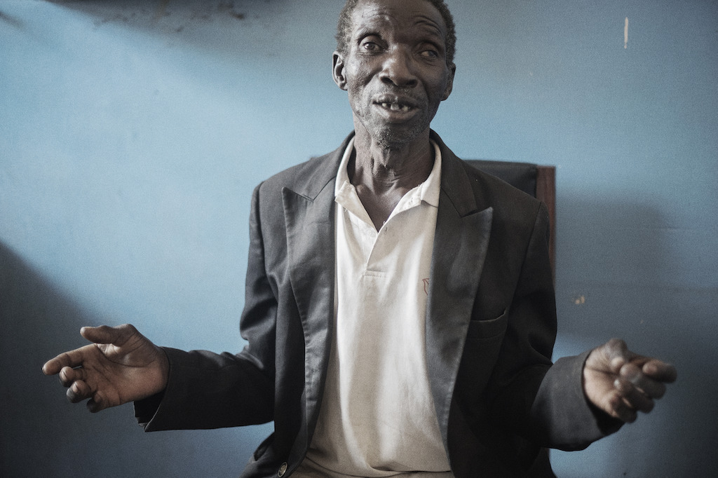 Nsanje, Malawi: Seleman, 62 years, comes from a remote village and is clinically unwell. “I went for an HIV test at a health centre because I frequently fall sick. They found me with HIV. But I don’t believe the results are true. So I came to the hospital, I think they will tell me the truth.”<br/><br/>A second test confirmed that Seleman is HIV positive but he is still not convinced by the results. Photographer: Luca Sola