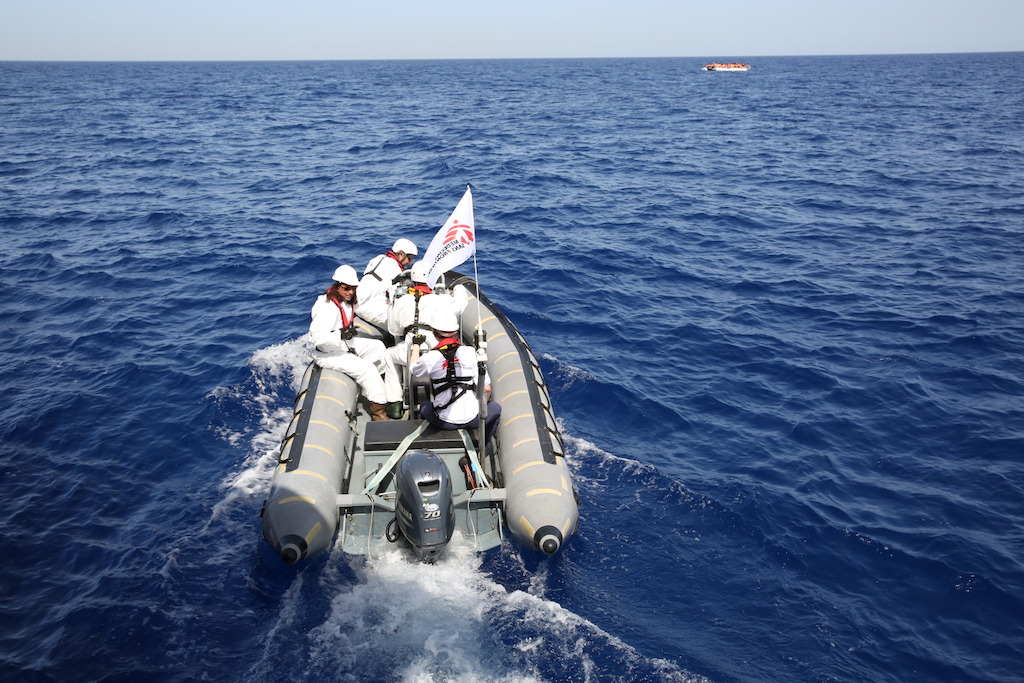 A member of the crew holds a little boy on 16 October. A large number of the rescued people are minors. They often sit along with the mothers in the middle of the flimsy boats, so if a crack appears they are in the most vulnerable position. Photohgrapher: Mohammad Ghannam