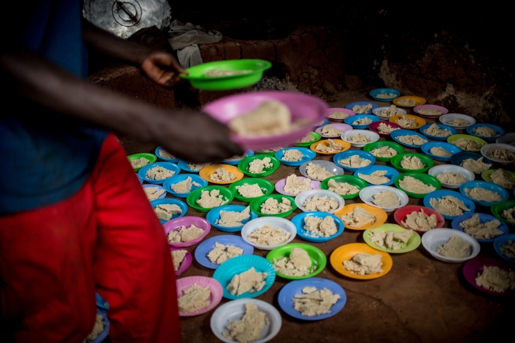 Refugees fleeing unrest and violence in Burundi find temporary shelter and food at Lumasi transit centre, across the border in Tanzania. They arrive either by crossing lake Tanganyika by boat, or by walking across the hilly hinterland. Photographer: Ikram N'gadi