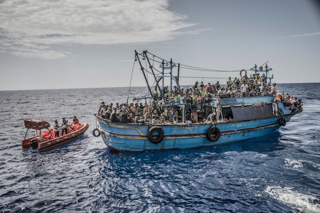 Photographer: Francesco Zizola<br/><br/>Caption: 26th August 2015. A boat containing approximately 650 people is rescued in the Mediterranean Sea by the Bourbon Argos and taken to Sicily, Italy.