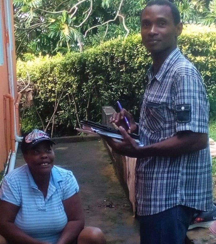 OECS Statistical Services Unit (SSU) and St. Lucia's Central Statistical Office (CSO) staff members conducting a survey with the use of tablets.