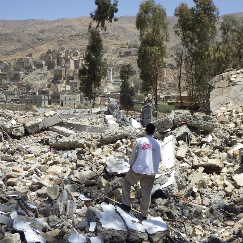 An MSF staff member surveys the ruins of MSF's hospital in Haydan, Yemen, after it was destroyed by airstrikes. Photographer: Atsuhiko Ochiai