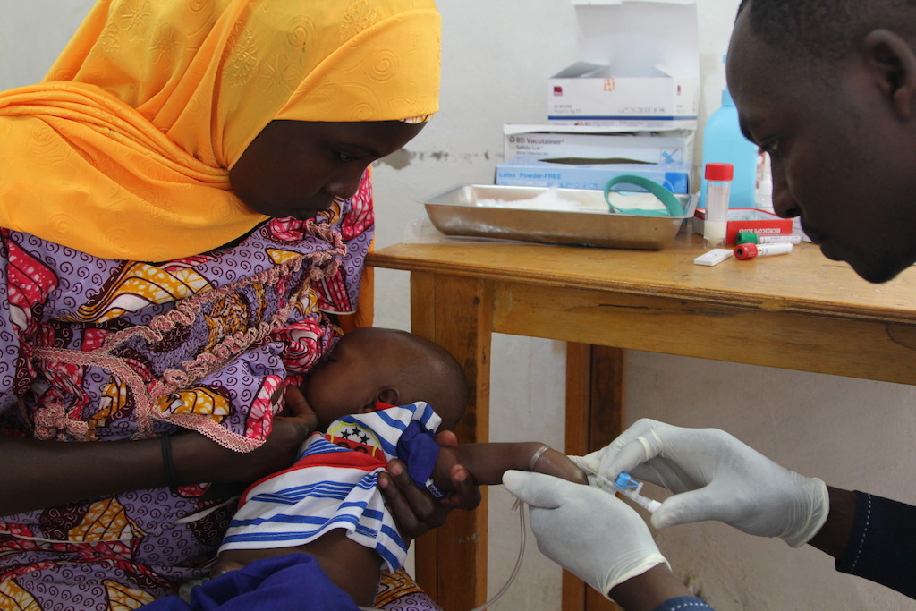 Eight-week-old Mohamed Zakari receives his first dose of the oral rotavirus vaccine (or the placebo). Eight weeks is the cut-off age.