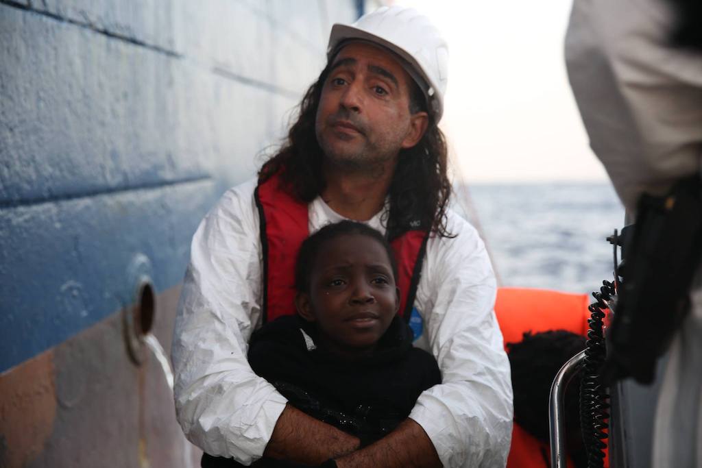 Me holding Nora - 8 years old from Nigeria - just before embarking Dignity I. Photographer: Mohammad Ghannam
