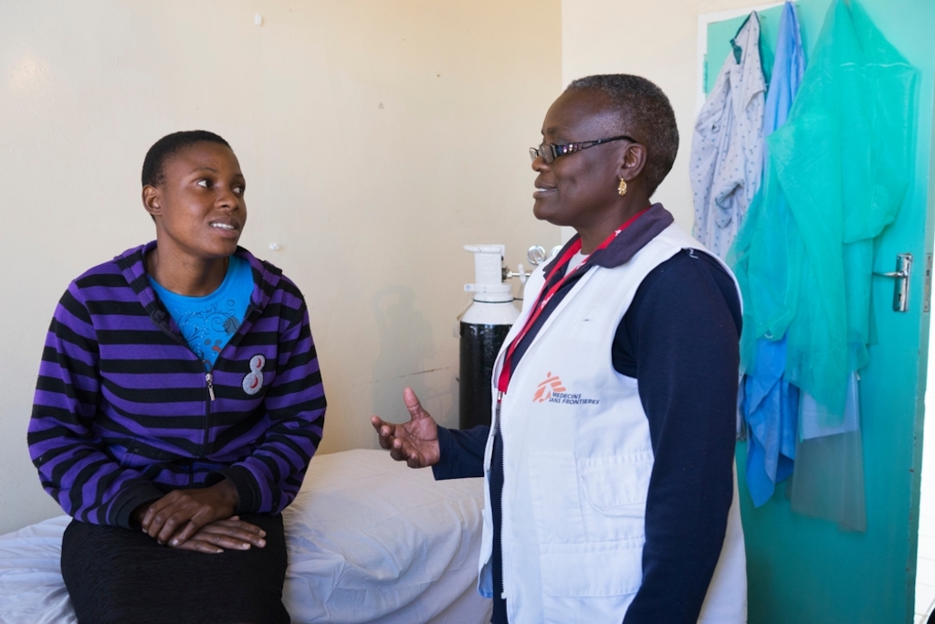24 year old Tracy speaks with a member of MSF staff. <br/><br/>Tracy had HPV and was tested for VIAC without knowing it. They discovered in November 2015 more than 75% lesions. SHe was referred to Harare, thanks help from Medecins Sans Frontieres (MSF), and LEEP. Her son was hit by a car 3 weeks ago, so she has been stuck at Gutu Mission Hospital with him and has not been able to go back to VIAC test to see if the lesions are still there. Photographer: Melanie Wenger/COSMOS