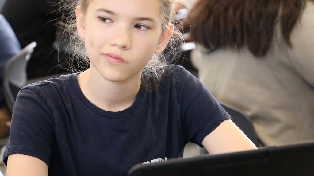 A student at Newport-Mesa USD in California considers her essay using Turnitin Revision Assistant.